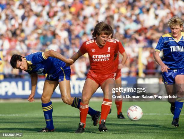 Jan Molby of Liverpool and Lawrie Sanchez of Wimbledon battle for the ball during a Barclays League Division One match between Wimbledon and...