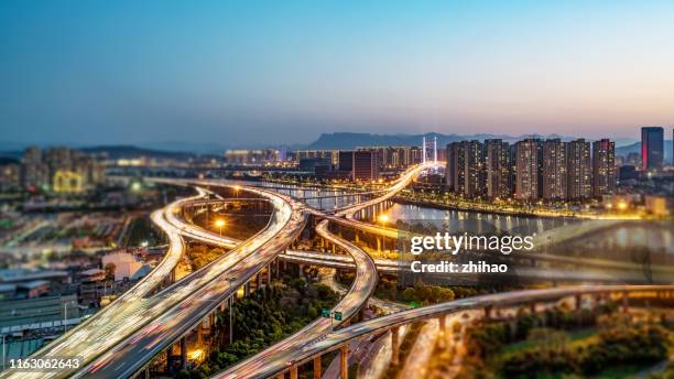 modern city bridge road junction night view - 福州市 ストックフ��ォトと画像