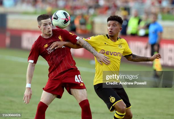 Ryan Kent of Liverpool competes with Jadon Sancho of Borussia Dortmund during the pre-season friendly match between Borussia Dortmund and Liverpool...