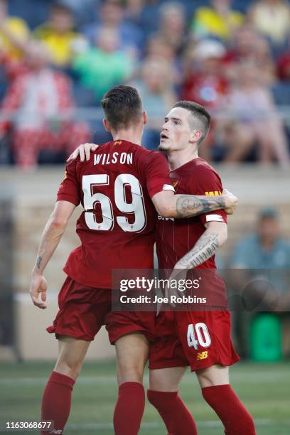 Ryan Kent of Liverpool FC celebrates with Harry Wilson after scoring a goal against Borussia Dortmund in the first half of the preseason friendly...