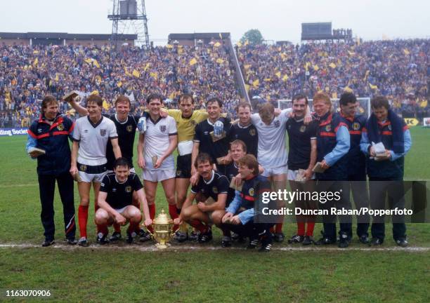 Scotland players celebrate with the trophy after the Rous Cup match between Scotland and England at Hampden Park on May 25, 1985 in Glasgow,...