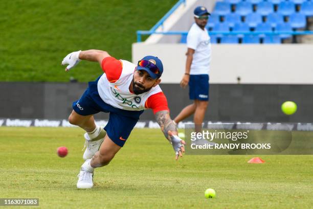 Virat Kohli of India takes part in a training session one day ahead of the 1st Test between West Indies and India at Vivian Richards Cricket Stadium,...