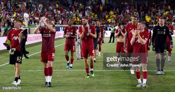 Nathaniel Phillips of Liverpool shows his appreciation to the fans at the end of the pre-season friendly match between Borussia Dortmund and...