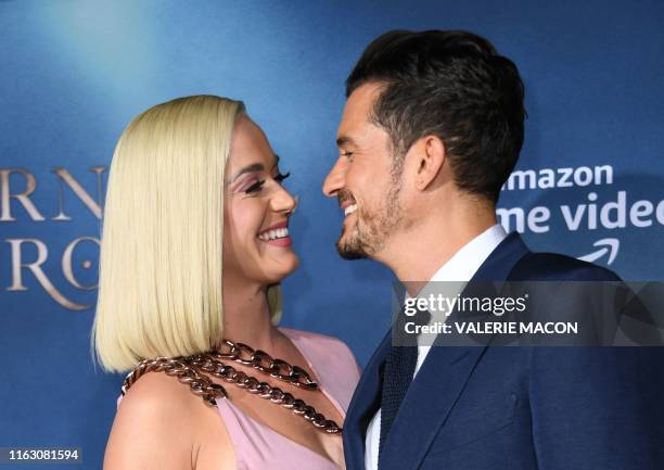 British actor Orlando Bloom and US singer/songwriter Katy Perry arrive for the Los Angeles premiere of Amazon Original Series "Carnival Row" at the...