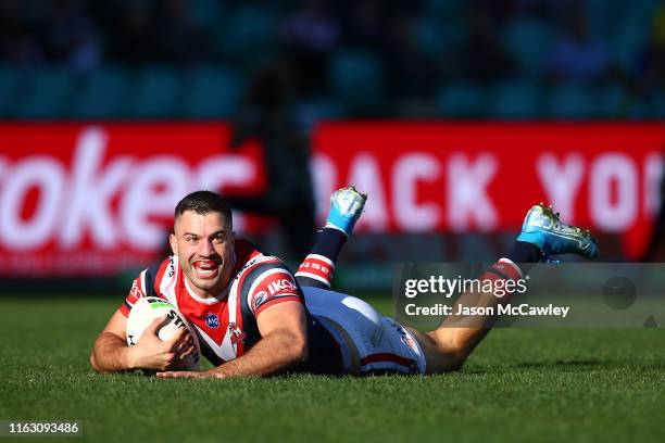 James Tedesco of the Roosters scores a try during the round 18 NRL match between the Sydney Roosters and the Newcastle Knights at Sydney Cricket...