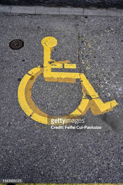 handicap parking sign at downtown biel, switzerland - schild schweiz stock-fotos und bilder