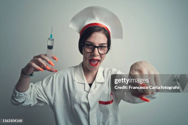 menacing nurse - crazy doctor stock pictures, royalty-free photos & images