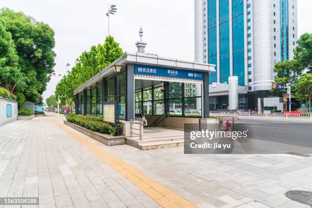 wuhan, hubei province, wuhan metro station ground exit. - wuhan stock pictures, royalty-free photos & images