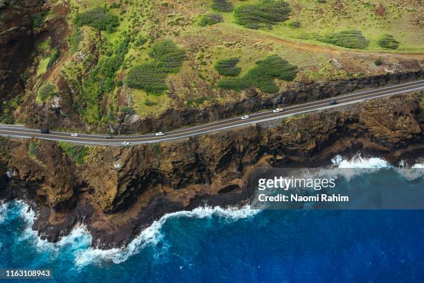 kalanianaole highway hugs the rugged coastal cliffs near honolulu, hawaii - hawaii seascape stock pictures, royalty-free photos & images