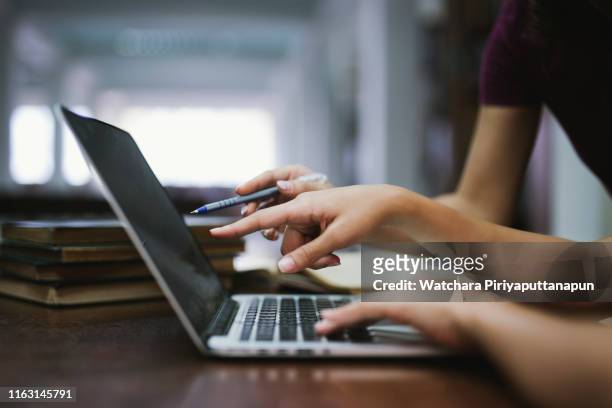 two young women working and used computer, working concept."r - computer demonstration stock pictures, royalty-free photos & images