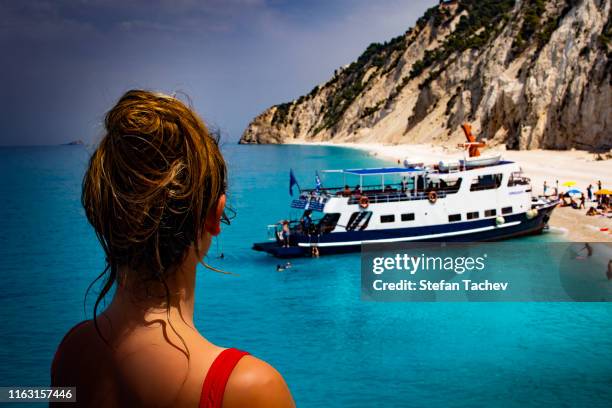 beautiful girl on the egremni beach, lefkada greece - egremni beach stock pictures, royalty-free photos & images