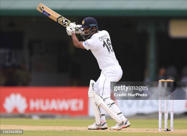 Sri Lankan cricket captain Dimuth Karunaratne plays a shot during the first day's play of the second test cricket match between Sri Lanka and New...