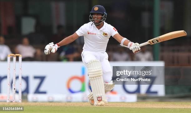 Sri Lankan cricketer Kusal Mendis shouts to avoid a run out during the first day's play of the second test cricket match between Sri Lanka and New...