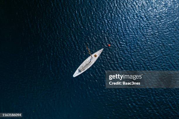 sailboat anchored up - yacht top view stock-fotos und bilder