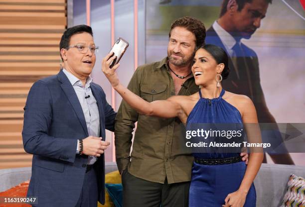Raul Gonzalez, Gerard Butler and Francisca Lachapel are seen on the set of Despierta America at Univision Studios to promote the film "Angel Has...