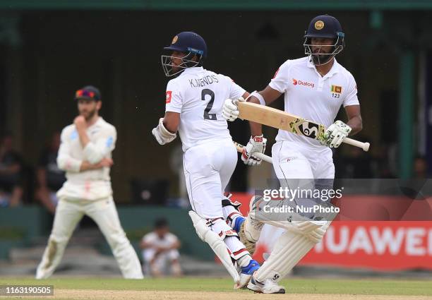 Sri Lankan cricket captain Dimuth Karunaratne and Kusal Mendis run between the wickets during the first day's play of the second test cricket match...