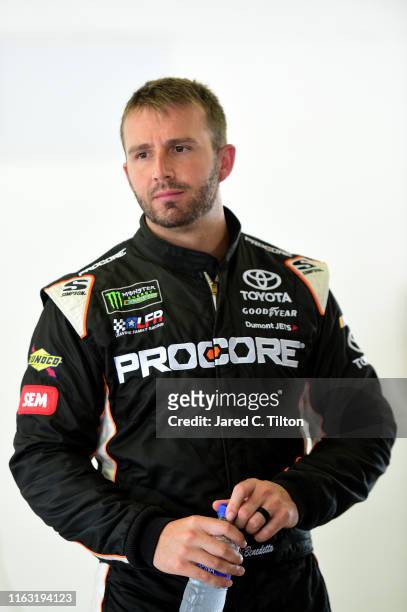 Matt DiBenedetto, driver of the Procore Toyota, looks on during practice for the Monster Energy NASCAR Cup Series Foxwoods Resort Casino 301 at New...