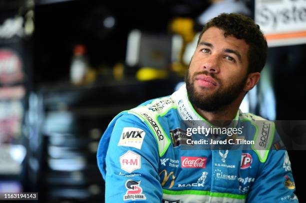 Bubba Wallace, driver of the Victory Junction Chevrolet, looks on during practice for the Monster Energy NASCAR Cup Series Foxwoods Resort Casino 301...