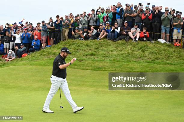 Shane Lowry of Ireland acknowledges the crowd after a birdie on the tenth green during the third round of the 148th Open Championship held on the...