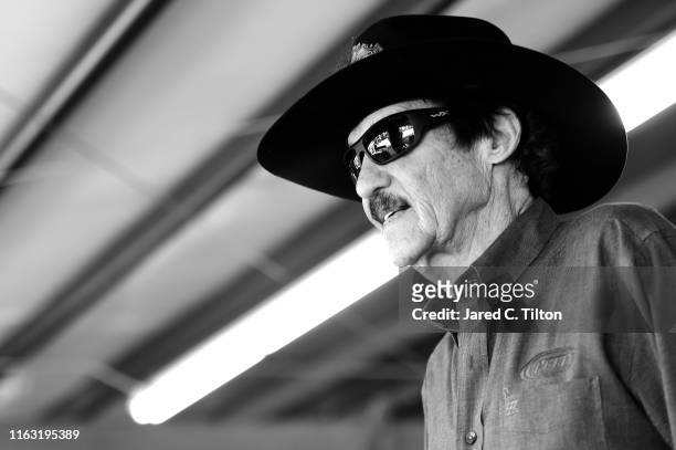 Hall of Famer Richard "The King" Petty stands in the garage area during practice for the Monster Energy NASCAR Cup Series Foxwoods Resort Casino 301...