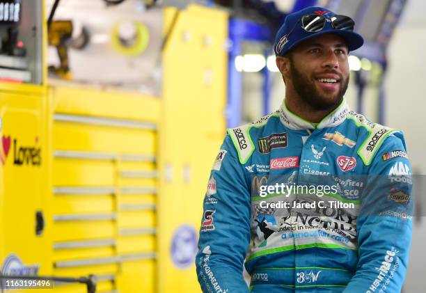 Bubba Wallace, driver of the Victory Junction Chevrolet, looks on during practice for the Monster Energy NASCAR Cup Series Foxwoods Resort Casino 301...