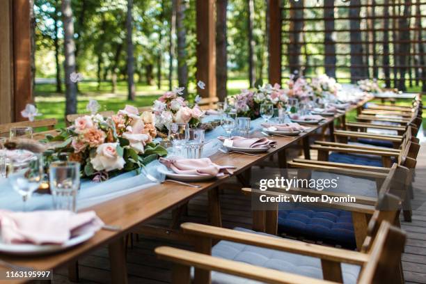 table decorations in gray and blue on rustic wedding - outdoor wedding ceremony stock pictures, royalty-free photos & images