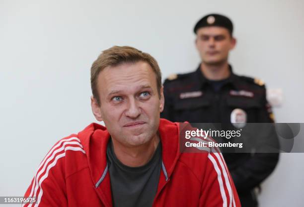 Alexey Navalny, Russian opposition leader, reacts during a hearing at the Simonovsky District Court in Moscow, Russia, on Thursday, Aug. 22, 2019....