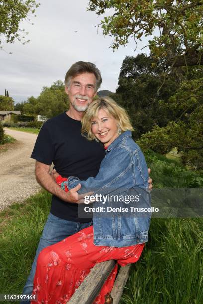 Singer, songwriter, actress, entrepreneur, dancer and activist Olivia Newton-John is photographed with husband John Easterling at their home on April...