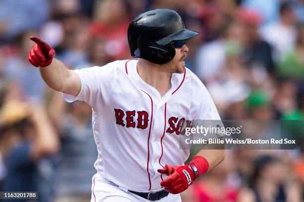 Brock Holt of the Boston Red Sox reacts after hitting a game winning walk-off RBI single during the tenth inning of a game against the Kansas City...