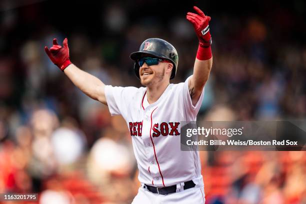 Brock Holt of the Boston Red Sox reacts after hitting a game winning walk-off RBI single during the tenth inning of a game against the Kansas City...