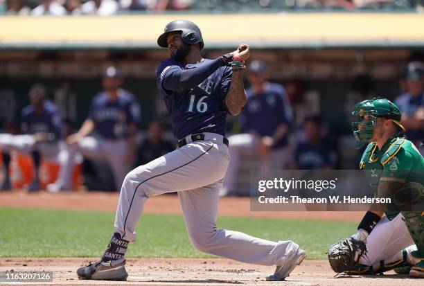 Domingo Santana of the Seattle Mariners bats against the Oakland Athletics in the top of the first inning at Ring Central Coliseum on July 17, 2019...