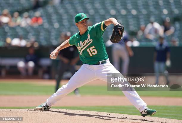 Homer Bailey of the Oakland Athletics pitches against the Seattle Mariners in the top of the first inning at Ring Central Coliseum on July 17, 2019...