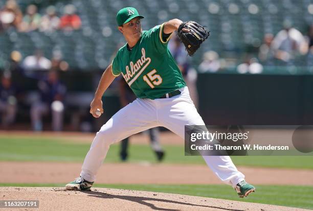 Homer Bailey of the Oakland Athletics pitches against the Seattle Mariners in the top of the first inning at Ring Central Coliseum on July 17, 2019...