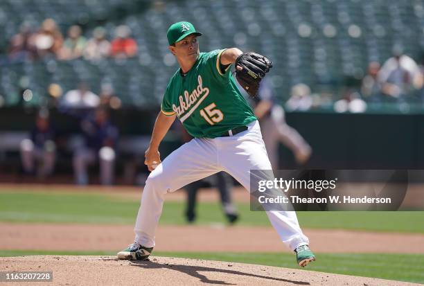 Homer Bailey of the Oakland Athletics pitches against the Seattle Mariners in the top of the first inning at Ring Central Coliseum on July 17, 2019...