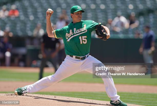 Homer Bailey of the Oakland Athletics pitches against the Seattle Mariners in the top of the first inning at Ring Central Coliseum on July 17, 2019...