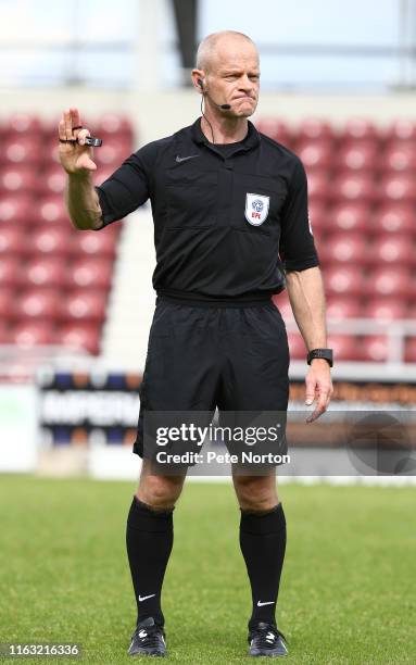 Referee Andy Woolmer looks on during a Pre-Season Friendly match between Northampton Town and Sheffield United at PTS Academy Stadium on July 20,...