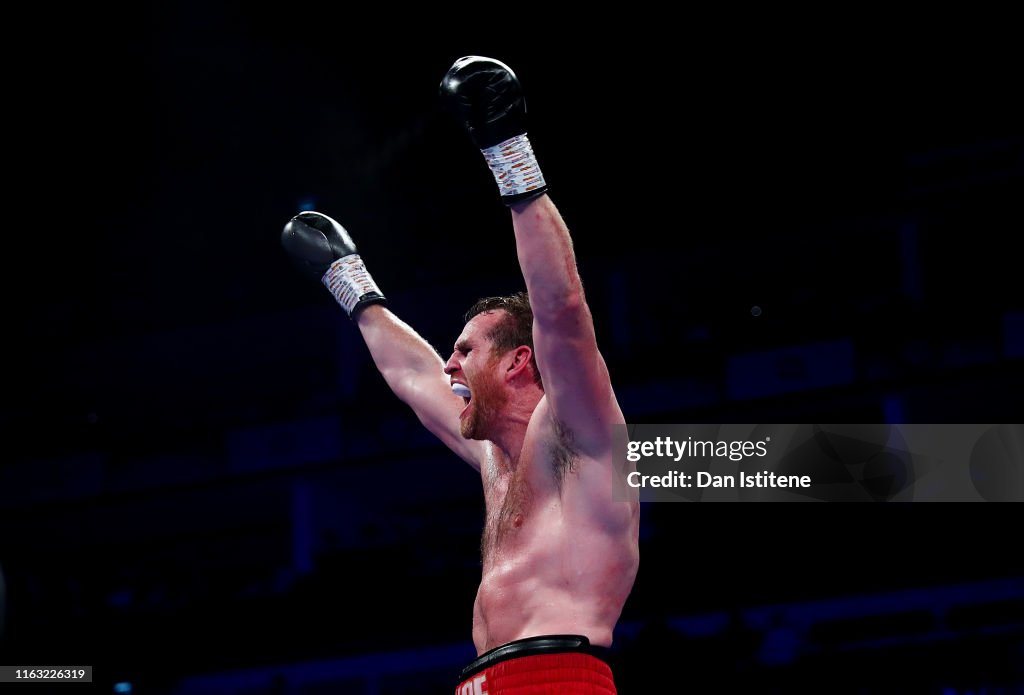 David Price celebrates victory over Dave Allen following the Vacant ...