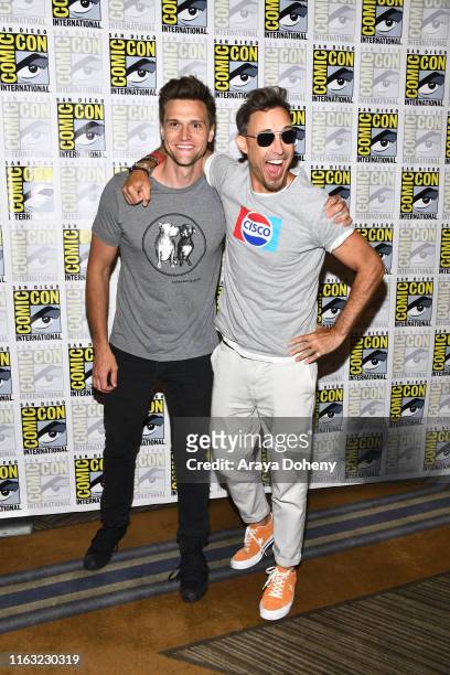 Hartley Sawyer and Thomas Cavanagh attend 2019 Comic-Con International - Day 3 "The Flash" press line on July 20, 2019 in San Diego, California.