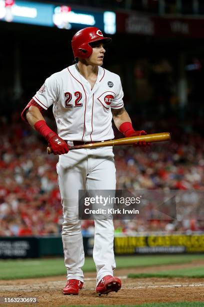 Derek Dietrich of the Cincinnati Reds walks back to the dugout after striking out during the game against the St. Louis Cardinals at Great American...