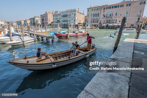 Venetians go by boat to the fish market in Rialto on July 20, 2019 in Venice, Italy. Redentore, which is in remembrance of the end of the 1577...