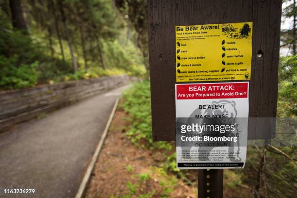 Bear attack warning sign stands at a trail head in Jackson Hole, Wyoming, U.S., on Thursday, Aug. 22, 2019. Over the past two decades, central...