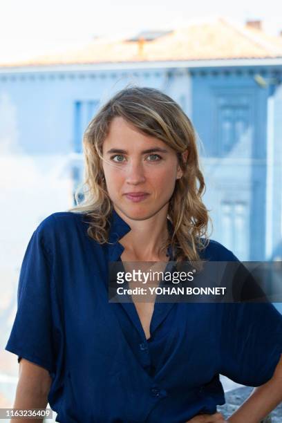 French actress Adele Haenel poses during a photocall of the film "Portrait de la jeune fille en feu" during the 12th Francophone Angouleme Film...