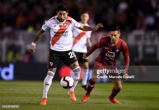 Milton Casco of River Plate fights for the ball with Oscar Ruiz of Cerro Porteño during a match between River Plate and Cerro Porteño as part of...