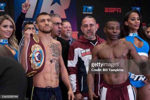 December 8: Vasiliy Lomachenko and Guillermo Rigondeaux weigh in and pose during the weigh in at Madison Square Garden on December 8, 2017 in New...