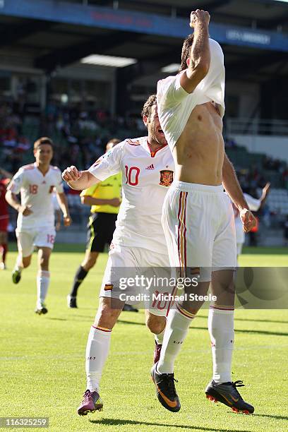 Adrian of Spain celebrates scoring his second goal as Juan Mata joins in during the UEFA European Under-21 Championship Group B match between Czech...