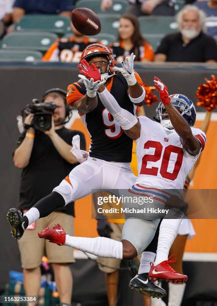 Damion Willis of the Cincinnati Bengals goes up for the passed ball as Janoris Jenkins of the New York Giants defends during the preseason game at...