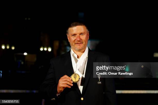 Yevgeny Kafelnikov poses for a picture after being inducted with the Class of 2019 in to the International Tennis Hall of Fame on July 20, 2019 in...