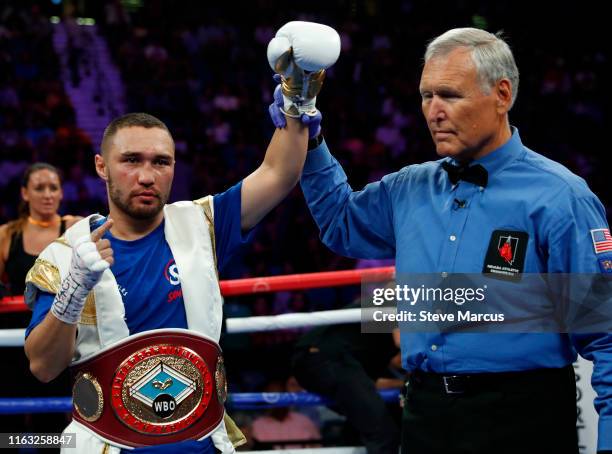 Sergey Lipinets poses with referee Jay Nady after defeating Jayar Inson during a welterweight bout at MGM Grand Garden Arena on July 20, 2019 in Las...