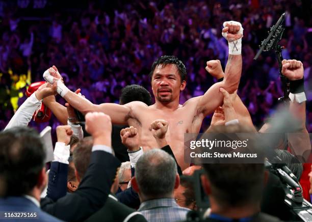 Manny Pacquiao celebrates his split decision victory over Keith Thurman in their WBA welterweight title fight at MGM Grand Garden Arena on July 20,...