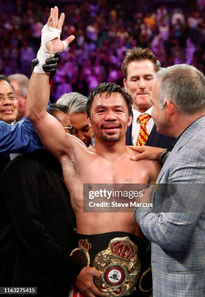 Manny Pacquiao poses after defeating Keith Thurman by split decision in a WBA welterweight title fight at MGM Grand Garden Arena on July 20, 2019 in...